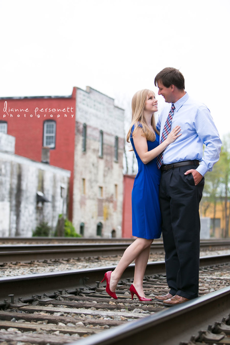 downtown Greensboro NC engagement photos with train tracks