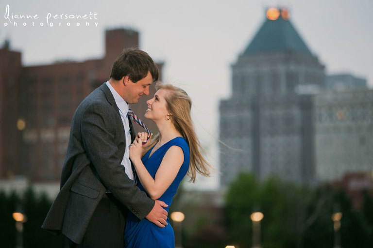 downtown greensboro nc engagement photos with greensboro skyline